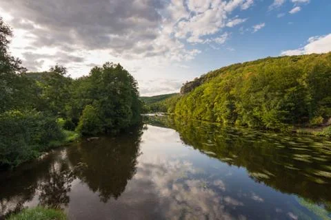 Landscape with reflection of water, clouds, forest, trees Foto stock