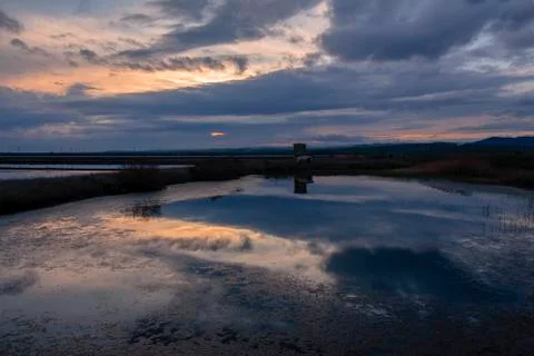 Landscape with reflections at sunset. Stock Photos