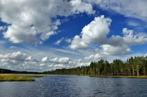 Landscape with river and clouds. Stock Photos