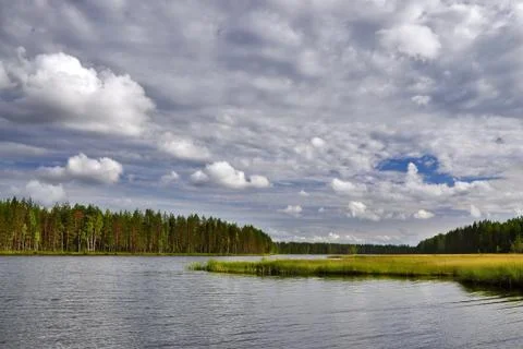 Landscape with river and clouds. Stock Photos