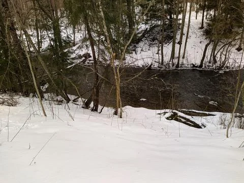 Landscape of the river flow in the forest in early spring and snow view from  Stock Photos
