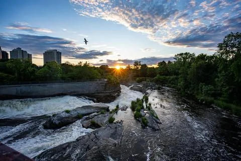 Landscape with river rapids at sunset in Hog's Back Park Stock Photos