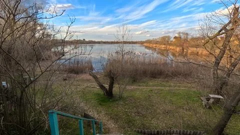 Landscape on the river. reflection of the sky in the water. on the shore. r.. Stock Photos