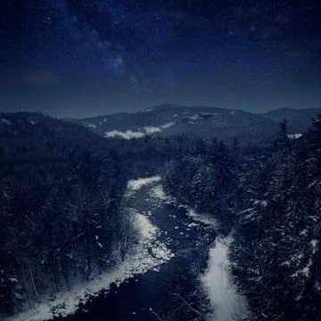 Landscape of River Through Mountains Stock Photos
