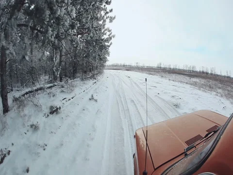 Landscape Road in the winter forest with snow covered wilderness Video stock 84912437