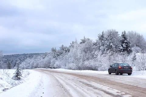 Landscape Road in the winter forest with snow covered Stock Photos