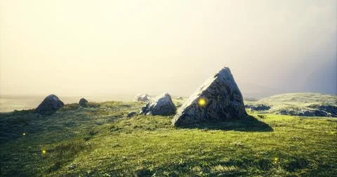 Landscape of rocks and grass under a bright sky at sunrise Illustrazione stock