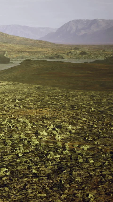 Landscape of rocky terrain under light sky at distant mountain range Stock Footage 336580456