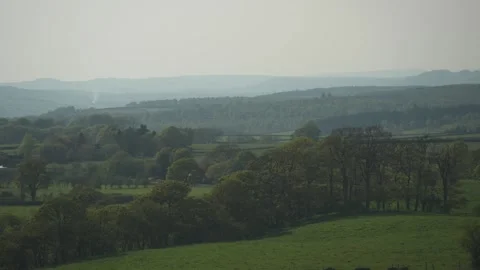 Landscape of rolling hills and trees at sunset near Baslow, Derbyshire, England Stock Footage 241418892