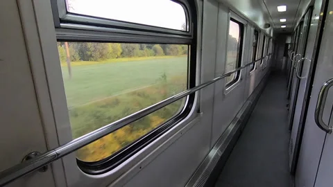 Landscape scenery fields and mountains from window of railway train Stock Footage 144444746