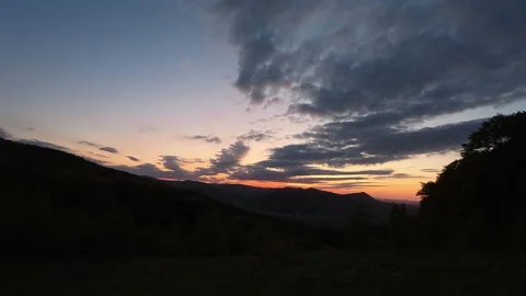 Landscape scenery of warm dusk sunset in mountains at summertime Stock Footage 329574740