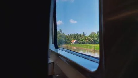 Landscape seen through a train window while traveling. Stock Photos