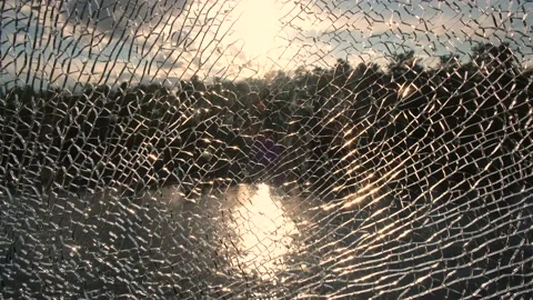 Landscape with the setting sun and reflection in the river through broken glass. Stock Footage 145860560