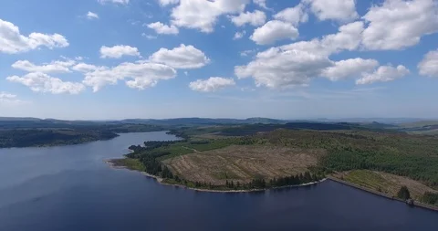 Landscape Shot with a Drone Featuring a Coast and Fluffy Clouds 스톡 동영상 97379827