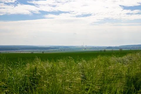 Landscape shot of fields and cloudy sky Stock Photos