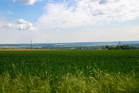 Landscape shot of fields and cloudy sky Stock Photos
