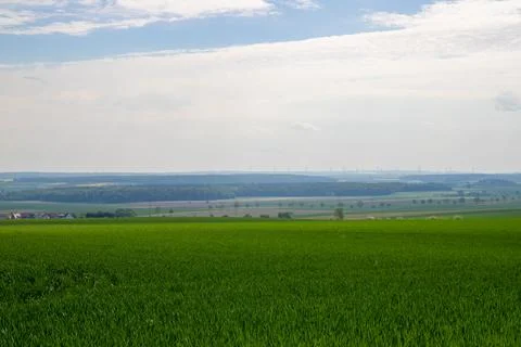 Landscape shot of fields and cloudy sky Stock Photos