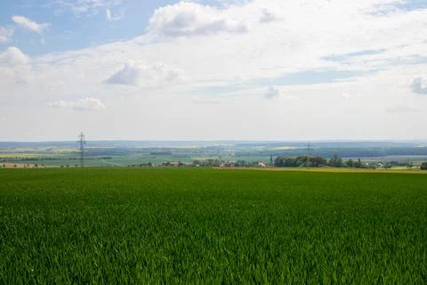 Landscape shot of fields and cloudy sky Stock Photos