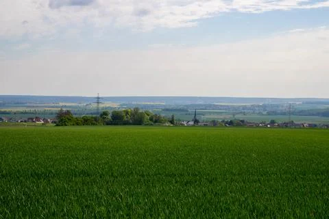 Landscape shot of fields and cloudy sky Stock Photos