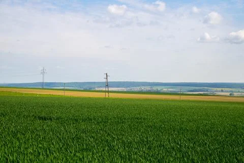 Landscape shot of fields and cloudy sky Stock Photos