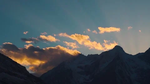 Landscape shot of sun rays above the snow covered Himalayan mountain peaks Stock Footage 341317882