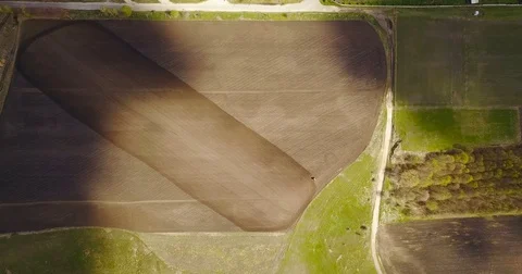 Landscape shot using drone. The field with the tractor. Tractor plowing land. Stock Footage 74509979