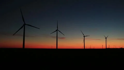 Landscape with the silhouette of the windmills moving in a wind farm Stock Footage 150782959