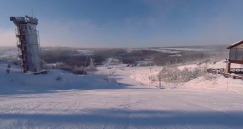 Landscape of a ski resort, view of one of the tracks covered with snow. Stock Footage 131560706
