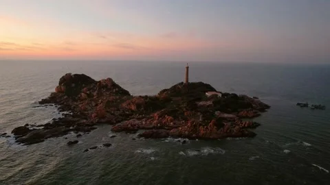 Landscape of small island with ancient lighthouse at sunrise sky Stock Footage 228660282