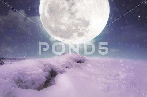 Landscape at snowfall with super moon. Serenity nature background. Stock Photos
