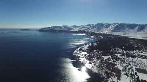 Landscape of snowy  lake Sevan in the background in Armenia Video stock 58614002
