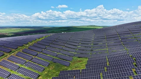 Landscape of solar modules under vast blue sky signifies hope. Bright solar Stock Footage 337910370