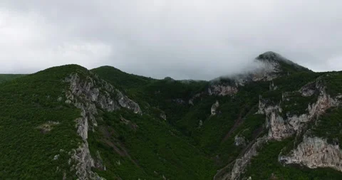 Landscape Storm Clouds Forming Over Large Cliffs In Rural Eastern Europe Drone Stock Footage 300442348