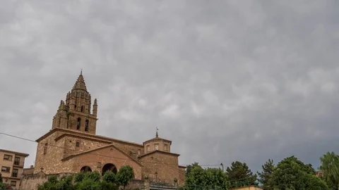 Landscape of storm clouds passing over the church bell tower time lapse. Video stock 81832316