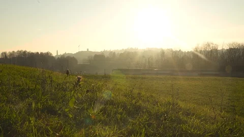 Landscape at sunset with far train with flare 스톡 동영상 73288065