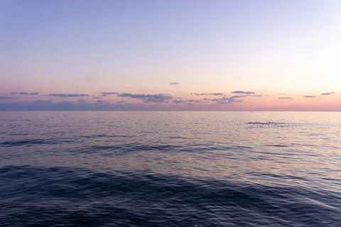 Landscape at sunset. Sky, clouds, blue sea Stock Photos
