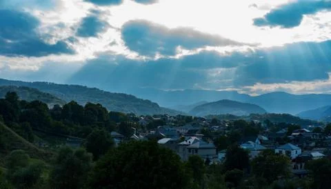 Landscape at sunset sunlight through the clouds Stock Photos