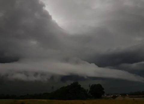 Landscape with threatening storm clouds. Stock Photos