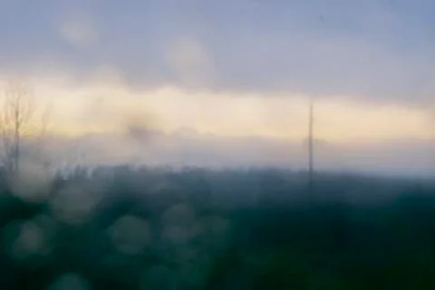 Landscape through a wet window Stock Photos