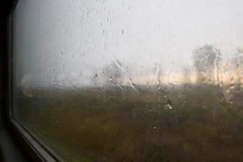 Landscape through a wet window Stock Photos