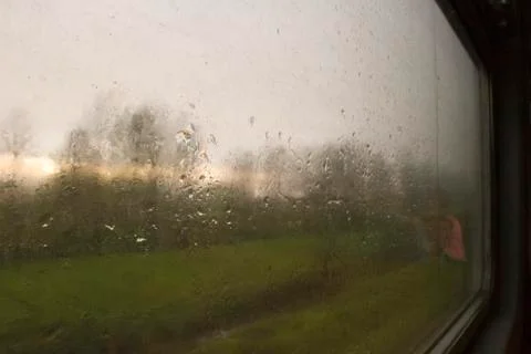 Landscape through a wet window Stock Photos