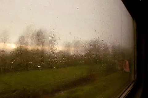 Landscape through a wet window Stock Photos