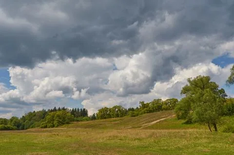 Landscape with thunder clouds sky. Natural summer background Stock Photos