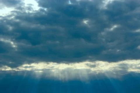 Landscape with thunderclouds and sunny rays. Rain expected. Weather is bad Stock Photos