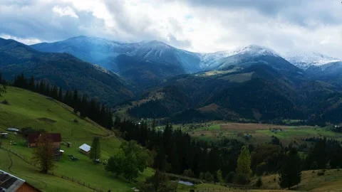 Landscape time-lapse with views of the mountains, sky, village and clouds. Stock Footage 142596517
