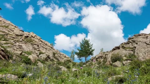 Landscape Timelapse UHD. Beautiful mountain and blue sky with white clouds. Stock Footage 78516693