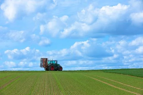 Landscape with tractor Stock Photos