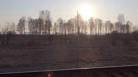 Landscape from the train window at dawn Stock Footage 78537586