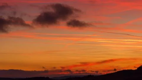 Landscape veiled in red clouds Stock Photos