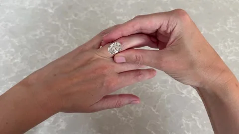 Landscape video of oval diamond ring displayed on woman’s hand Video stock 315389286